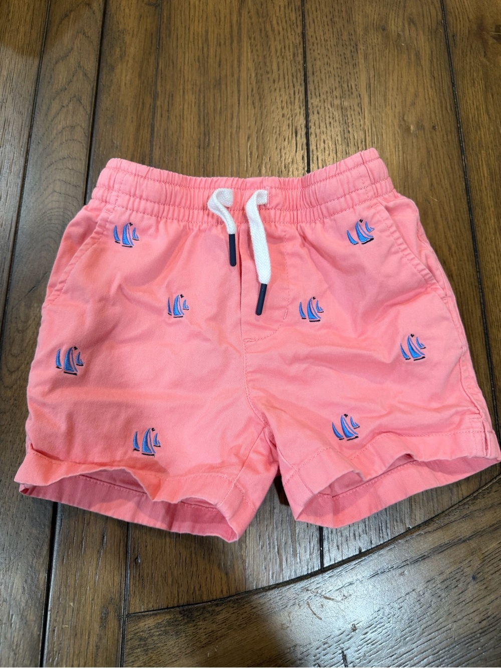 Vineyard Vines Coral Swim Shorts with Blue Sailboat Embroidery